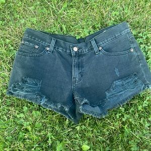 LEVI- Barley used- Charcoal, distressed shorts. Size is a 28.